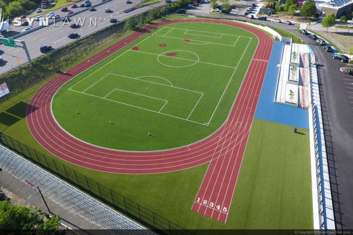 Drone shot artificial grass track field from SYNLawn