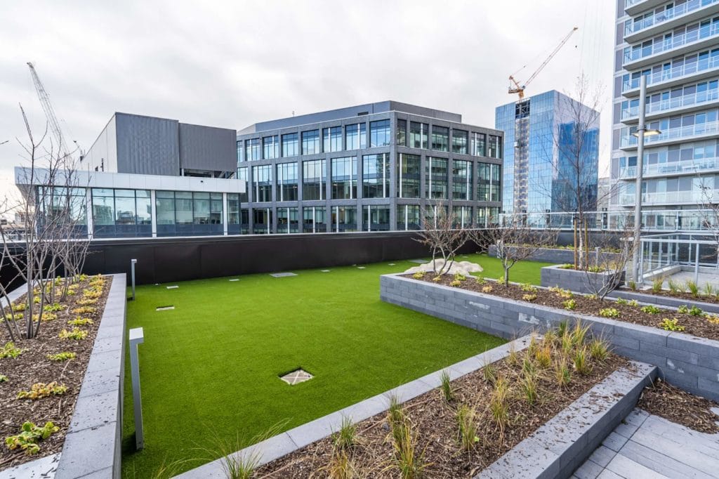 Putting green installed by apartment building